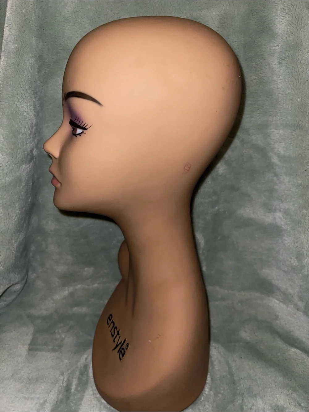 Tan Female Mannequin Head with Purple Makeup